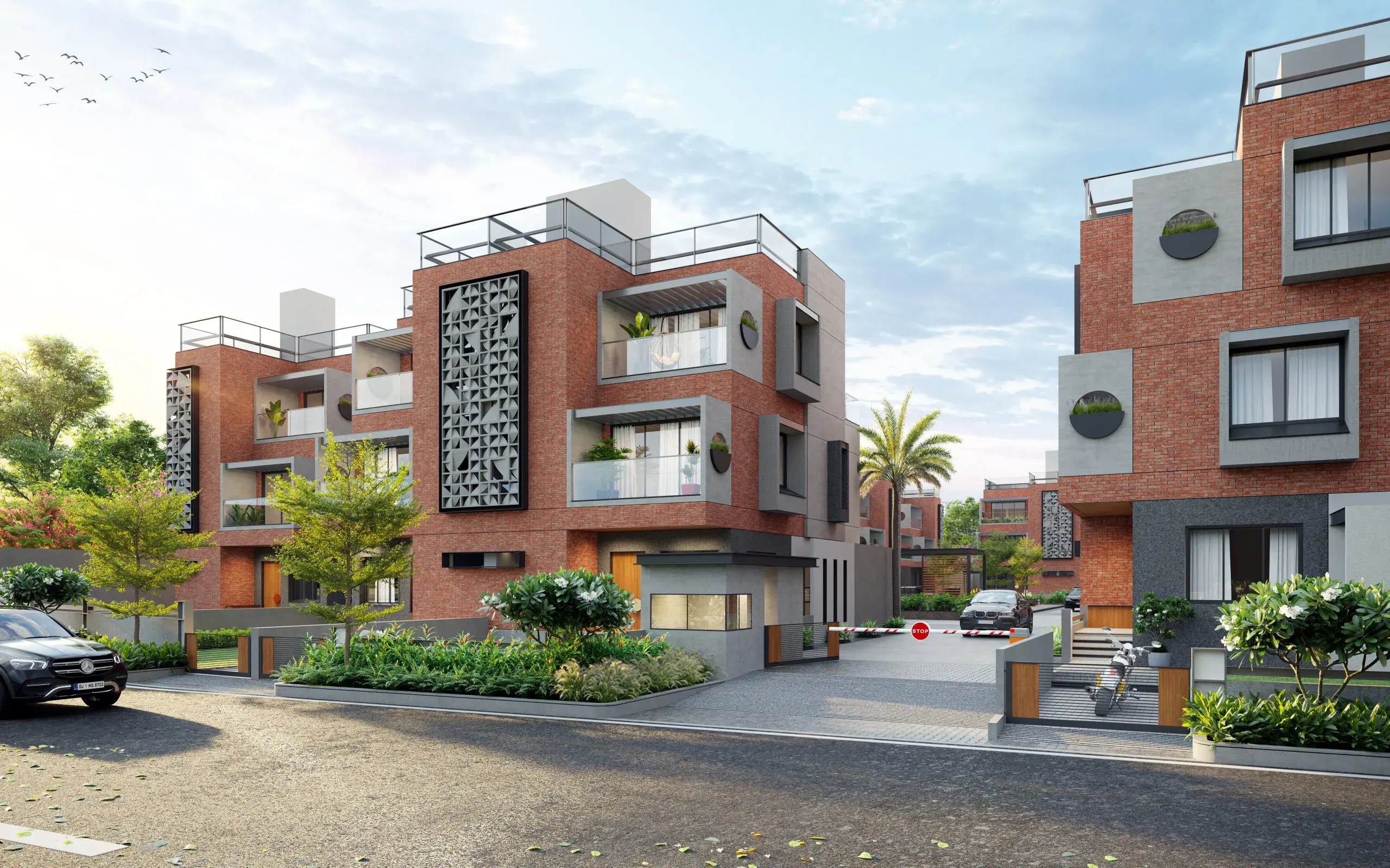 A Pramukh residential community with brick facades, balconies and landscaped streets